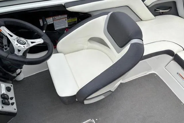 Slide: The Image of Interior of 2015 Yamaha Boats SX192, featuring steering wheel and cushioned seating. - 21