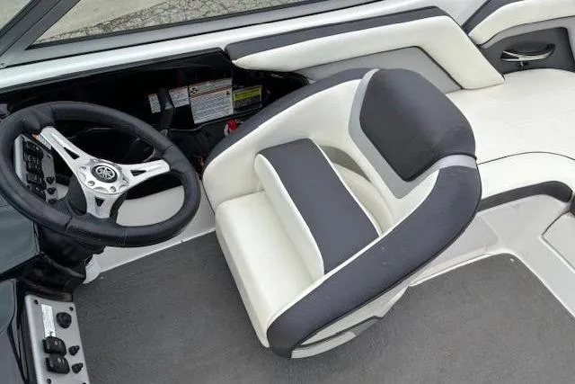 Slide: The Image of 2015 Yamaha Boats SX192 interior with steering wheel and seating. - 22