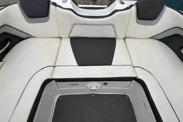 Slide: The Image of 2015 Yamaha Boats SX192 interior seating with white and black upholstery. - 26