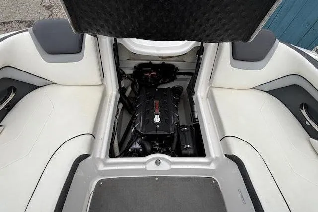 Slide: The Image of 2015 Yamaha Boats SX192 engine compartment with open hatch, showcasing interior seating and engine layout. - 27