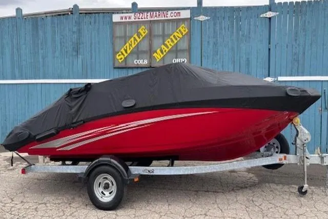 Slide: The Image of 2015 Yamaha Boats SX192, red with cover, on trailer at Sizzle Marine dealership. - 30