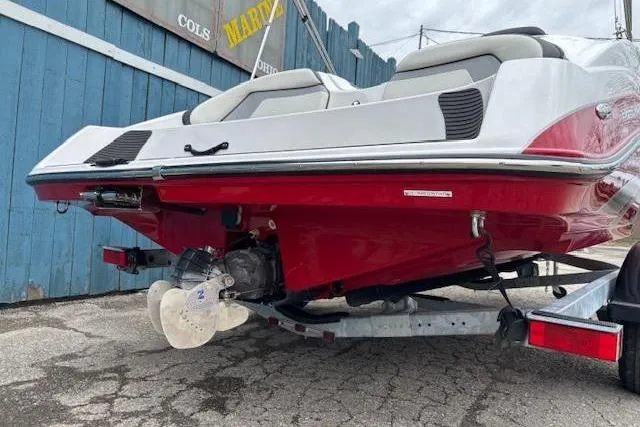 Slide: The Image of 2015 Yamaha Boats SX192 on trailer, showcasing red hull and propeller. - 5