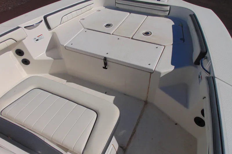 Slide: The Image of 2016 Yamaha Boats 190 FSH Sport interior seating and storage area. - 12