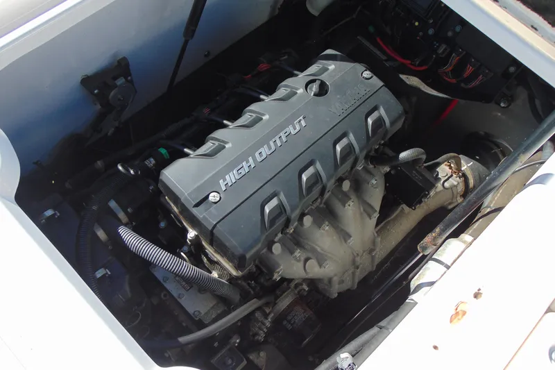 Slide: The Image of Engine compartment of a 2016 Yamaha Boats 190 FSH Sport, featuring a high-output engine. - 15