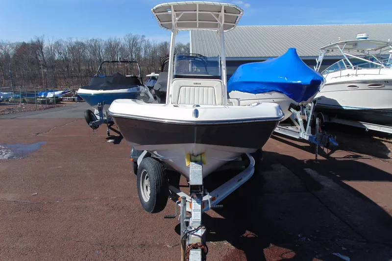Slide: The Image of 2016 Yamaha Boats 190 FSH Sport on trailer, parked outdoors. - 3