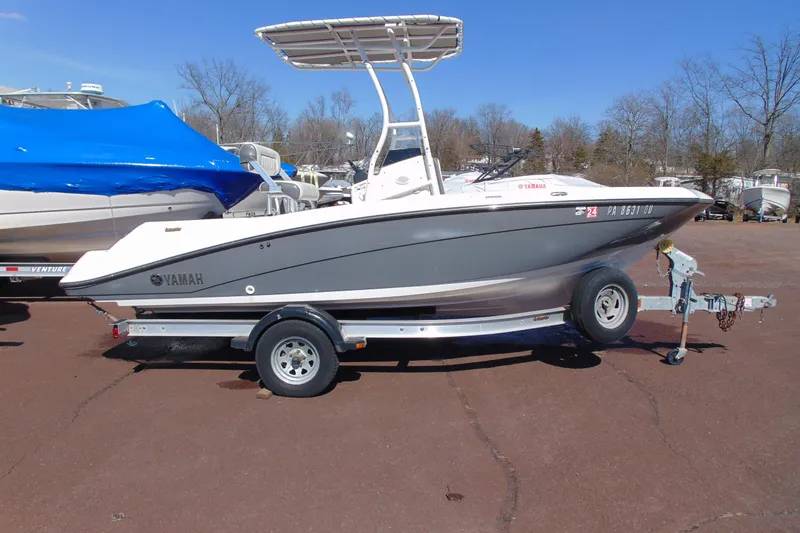 Slide: The Image of 2016 Yamaha Boats 190 FSH Sport on trailer, parked outdoors. - 4