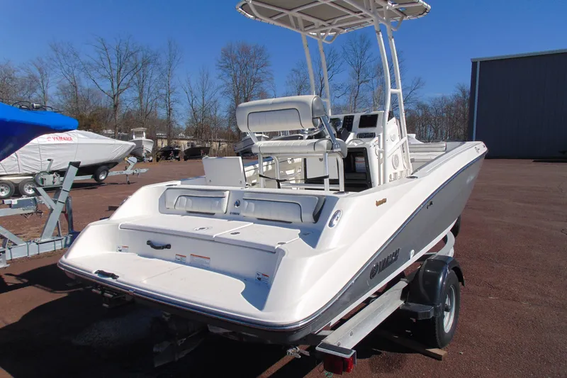 Slide: The Image of 2016 Yamaha Boats 190 FSH Sport on trailer, parked outdoors. - 5