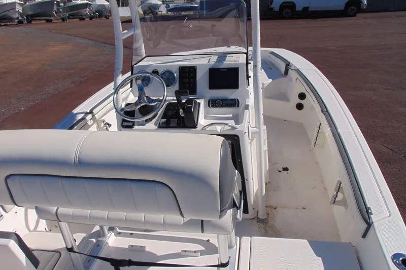 Slide: The Image of 2016 Yamaha Boats 190 FSH Sport interior with steering console and seating. - 7