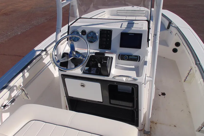 Slide: The Image of 2016 Yamaha Boats 190 FSH Sport dashboard with steering wheel and controls. - 9