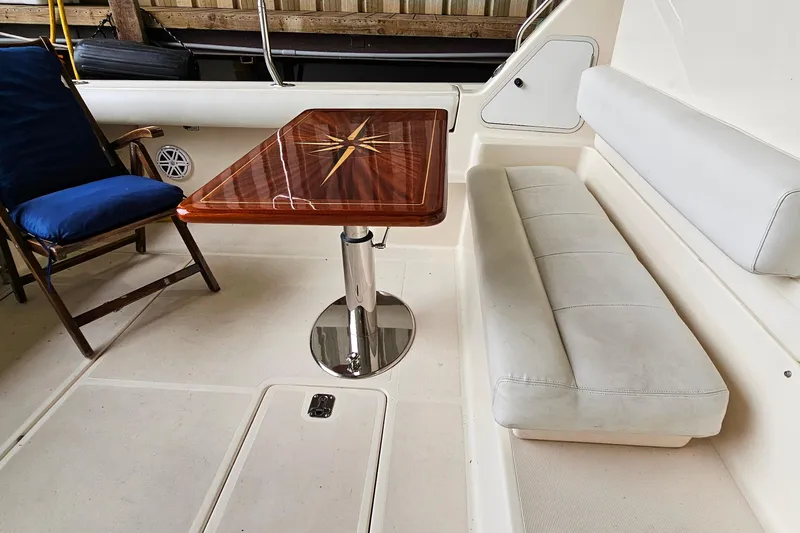 Slide: The Image of 1996 Tiara Yachts 4300 Open interior with elegant seating and wooden table. - 13