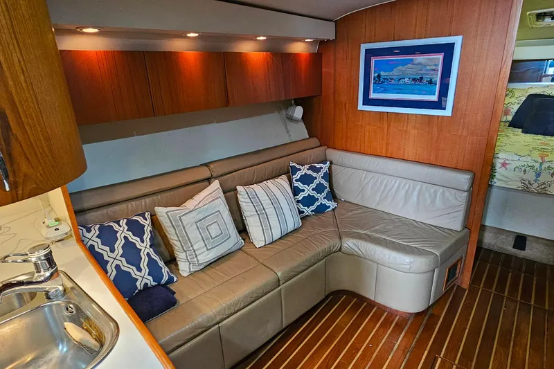 Slide: The Image of Luxurious 1996 Tiara Yachts 4300 Open interior with leather seating and decorative pillows. - 25