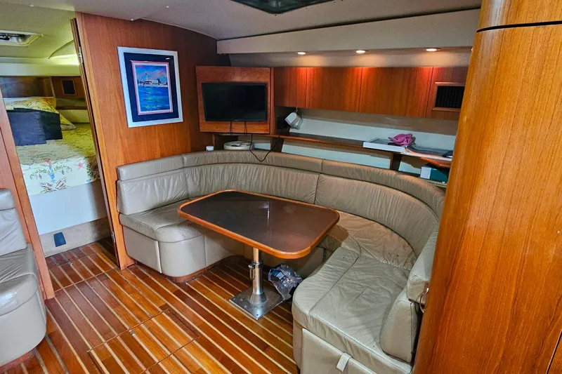 Slide: The Image of Luxurious interior of 1996 Tiara Yachts 4300 Open with leather seating and wooden finishes. - 26
