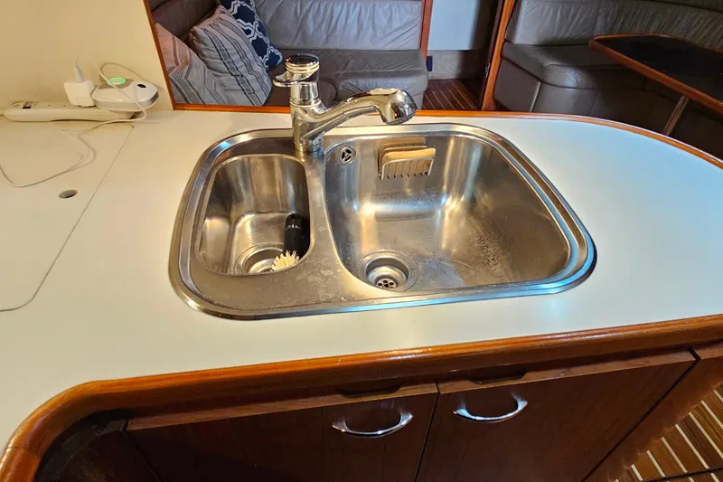 Slide: The Image of Stainless steel sink in 1996 Tiara Yachts 4300 Open galley, with faucet and countertop. - 30