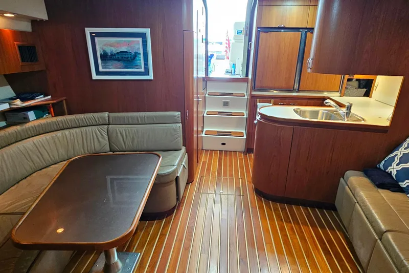 Slide: The Image of Luxurious interior of a 1996 Tiara Yachts 4300 Open with wood flooring and modern amenities. - 35