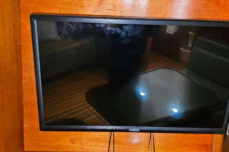 Slide: The Image of Vizio TV mounted on a 1996 Tiara Yachts 4300 Open interior wooden wall. - 40