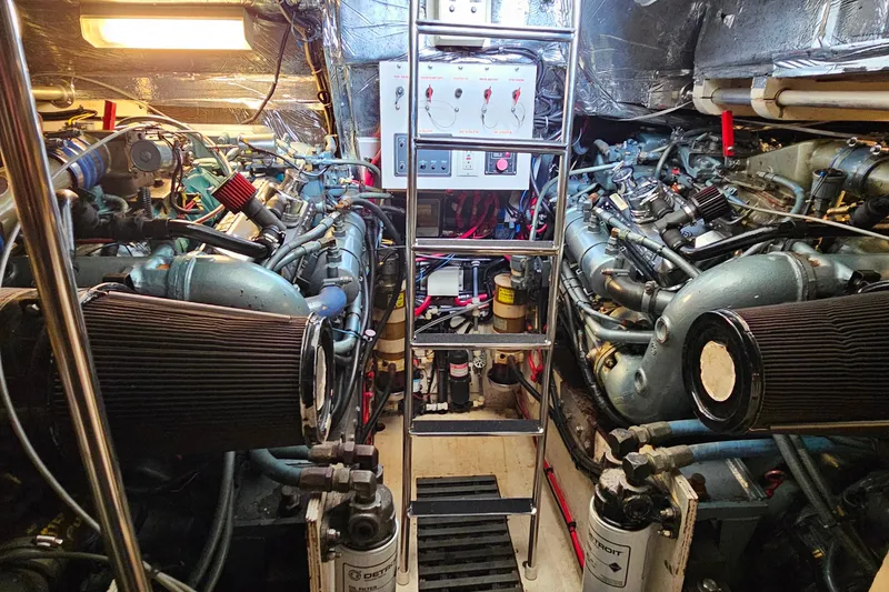 Slide: The Image of Engine room of a 1996 Tiara Yachts 4300 Open, featuring dual engines and control panel. - 41