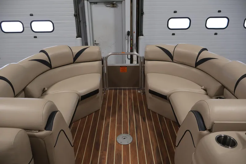 Slide: The Image of Luxurious interior of 2016 Berkshire 23E STS pontoon boat with plush seating and wood flooring. - 11