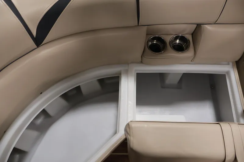 Slide: The Image of Interior of 2016 Berkshire 23E STS boat with beige seating and cup holders. - 17