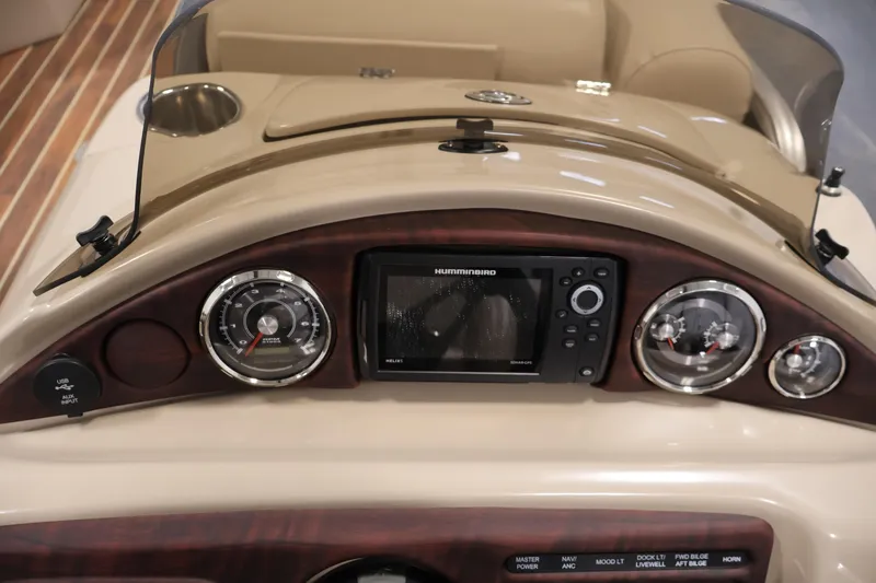 Slide: The Image of Dashboard of a 2016 Berkshire 23E STS boat with navigation controls. - 22