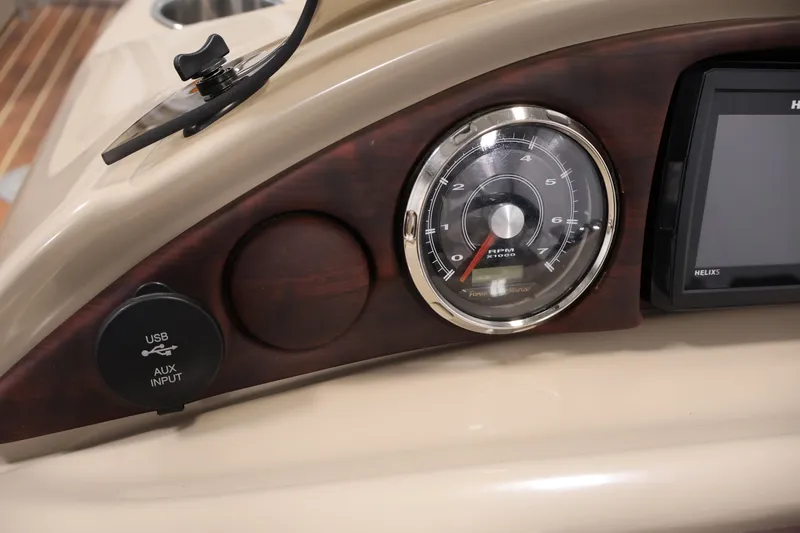Slide: The Image of Dashboard of 2016 Berkshire 23E STS with RPM gauge and USB/AUX input. - 23