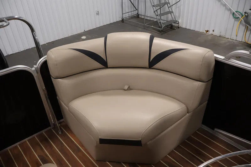 Slide: The Image of 2016 Berkshire 23E STS boat interior with beige cushioned seating. - 35