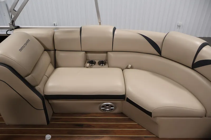 Slide: The Image of Luxurious beige seating on 2016 Berkshire 23E STS pontoon boat with cup holders and speaker. - 37