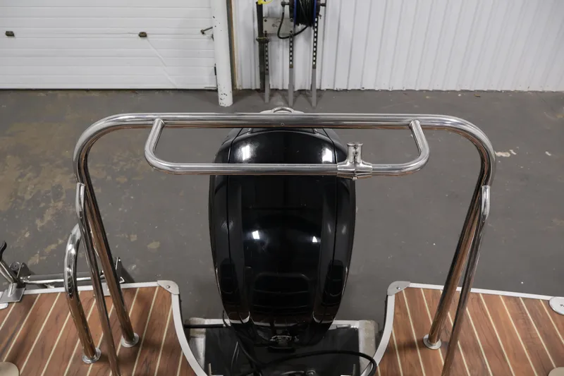 Slide: The Image of 2016 Berkshire 23E STS boat with stainless steel railing and outboard motor. - 40