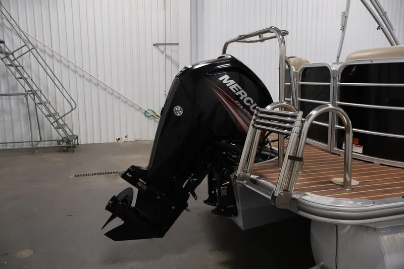 Slide: The Image of 2016 Berkshire 23E STS pontoon boat with Mercury outboard motor in a storage facility. - 43