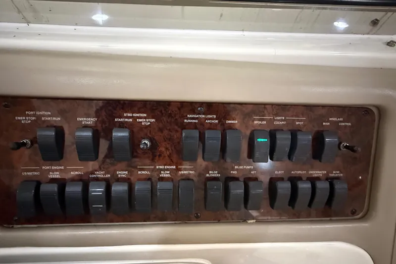 Slide: The Image of Control panel of a 2000 Sea Ray Sundancer 540 yacht with various switches and toggles. - 11