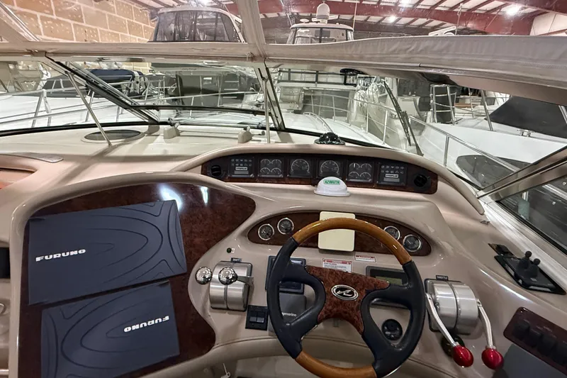Slide: The Image of Cockpit view of 2000 Sea Ray Sundancer 540 yacht with navigation equipment. - 12