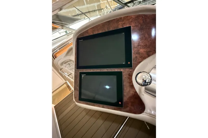 Slide: The Image of Control panel of a 2000 Sea Ray Sundancer 540 yacht with dual screens. - 14