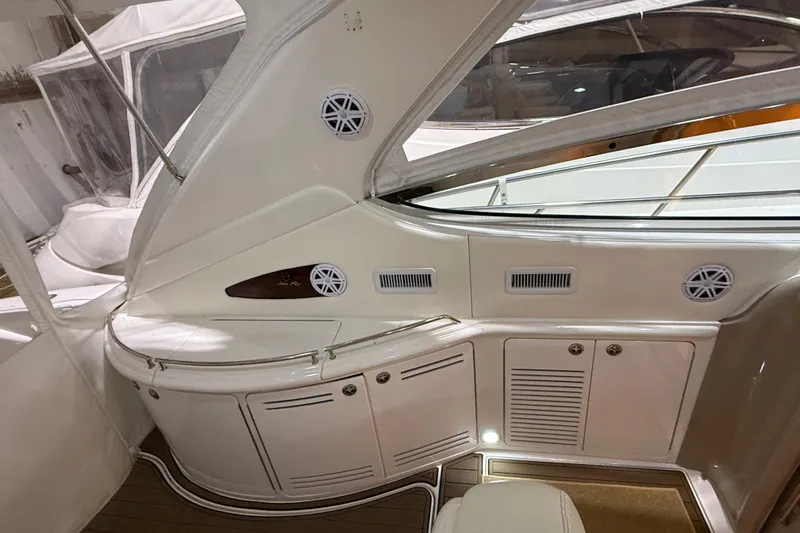 Slide: The Image of Interior view of a 2000 Sea Ray Sundancer 540 yacht, featuring sleek cabinetry and modern design. - 18
