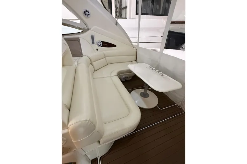 Slide: The Image of Luxurious interior of 2000 Sea Ray Sundancer 540 with white seating and table. - 19