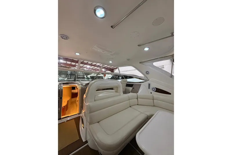 Slide: The Image of Interior of 2000 Sea Ray Sundancer 540 yacht with white leather seating. - 21
