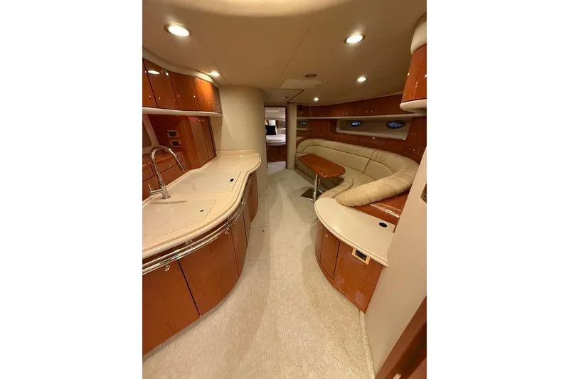 Slide: The Image of Luxurious interior of 2000 Sea Ray Sundancer 540 yacht with elegant wood finishes. - 26