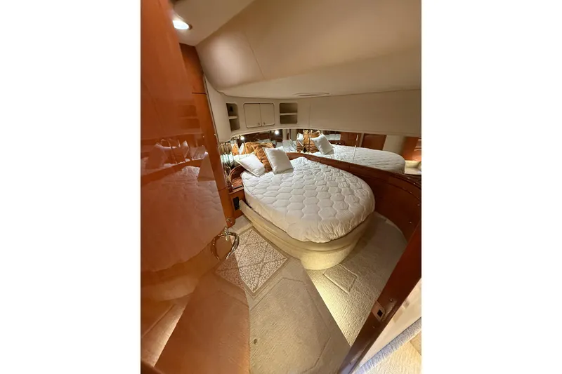 Slide: The Image of Luxurious cabin interior of 2000 Sea Ray Sundancer 540 yacht with plush bedding. - 27