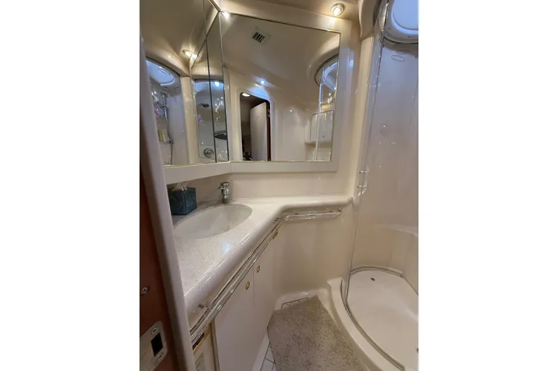 Slide: The Image of Luxurious bathroom in 2000 Sea Ray Sundancer 540 yacht with modern fixtures and shower. - 32