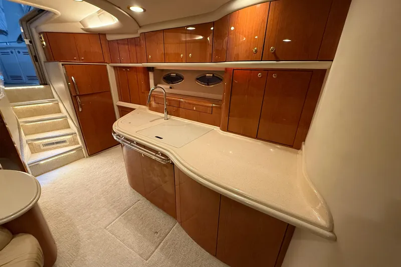 Slide: The Image of Luxurious interior of 2000 Sea Ray Sundancer 540 yacht with elegant wood cabinetry. - 34