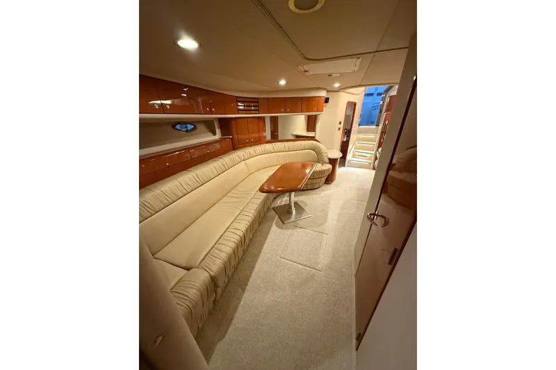 Slide: The Image of Luxurious interior of 2000 Sea Ray Sundancer 540 yacht with plush seating and elegant wood finishes. - 39