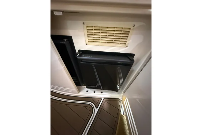Slide: The Image of Interior of 2000 Sea Ray Sundancer 540 with compact fridge and vent. - 43