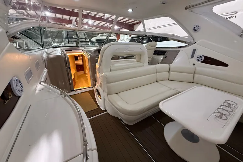 Slide: The Image of Luxurious interior of a 2000 Sea Ray Sundancer 540 yacht with plush seating and elegant design. - 44