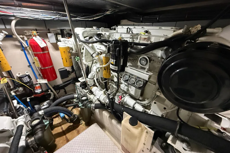 Slide: The Image of Engine room of a 2000 Sea Ray Sundancer 540 yacht, featuring CAT machinery and safety equipment. - 46