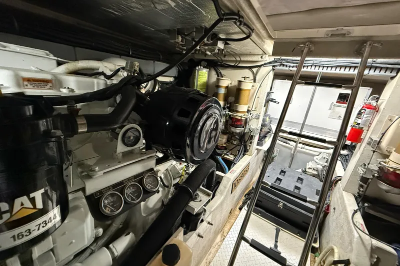Slide: The Image of Engine room of a 2000 Sea Ray Sundancer 540 yacht, featuring CAT machinery and equipment. - 47