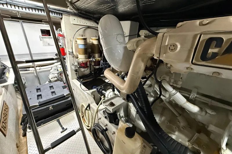Slide: The Image of Engine room of a 2000 Sea Ray Sundancer 540 yacht, showcasing mechanical components. - 48