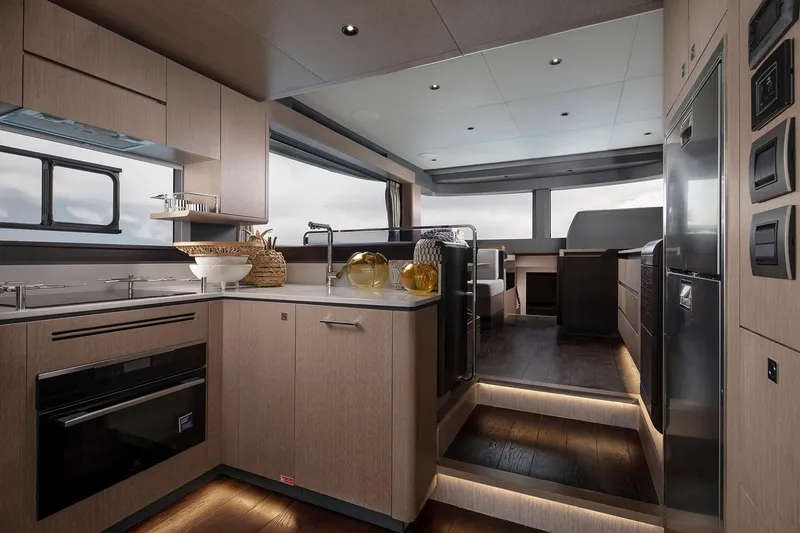 Slide: The Image of Luxurious interior of 2025 Sirena 48 yacht featuring modern kitchen and elegant design. - 11