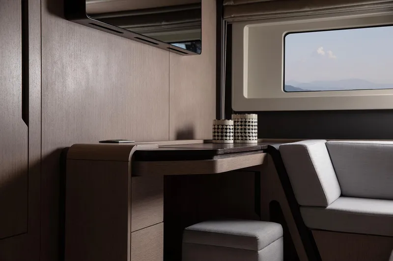 Slide: The Image of Modern interior of 2025 Sirena 48 yacht with sleek wood finish and window view. - 14