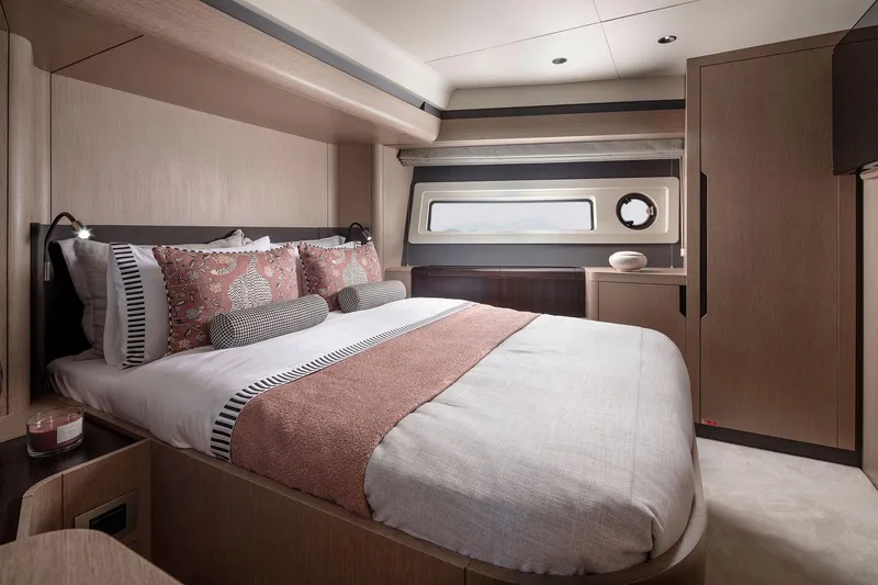 Slide: The Image of Luxurious bedroom interior of 2025 Sirena 48 yacht with modern design and elegant decor. - 16