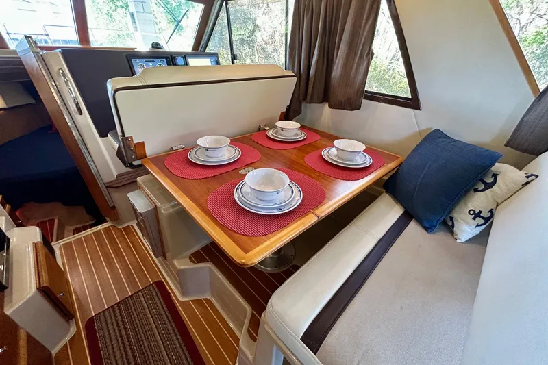 Slide: The Image of Interior of 2016 Cutwater C-30 CB boat with dining table set for four. - 18