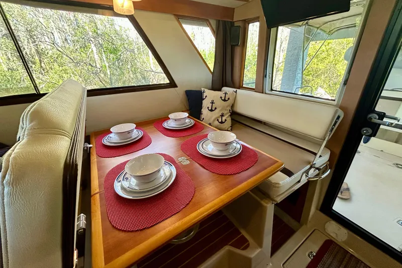 Slide: The Image of Interior of 2016 Cutwater C-30 CB yacht with dining table set for four. - 19