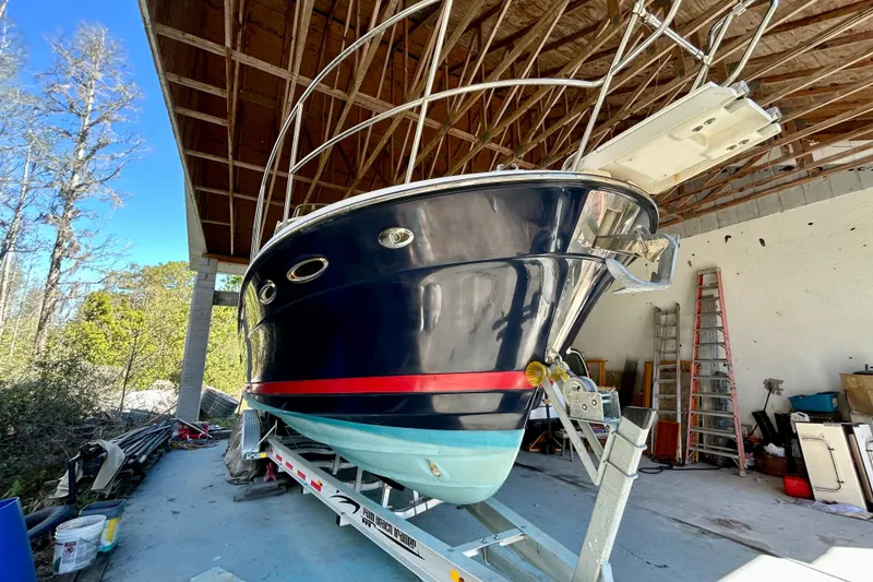 Slide: The Image of 2016 Cutwater C-30 CB boat on trailer in covered storage area. - 4
